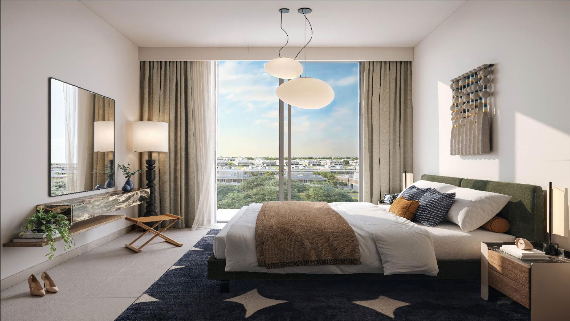 Luxurious living room with golf course views in Dubai Hills Estate apartment for sale