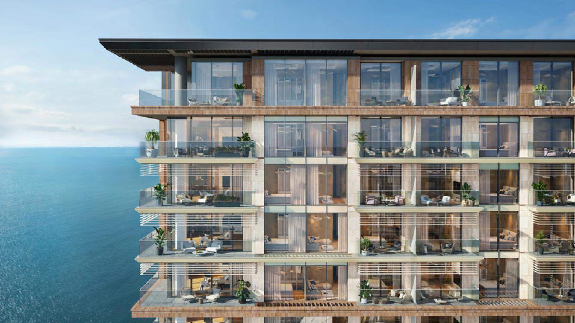 Infinity pool overlooking ocean at sunset, luxury apartment in Playa Del Sol, Al Marjan Island