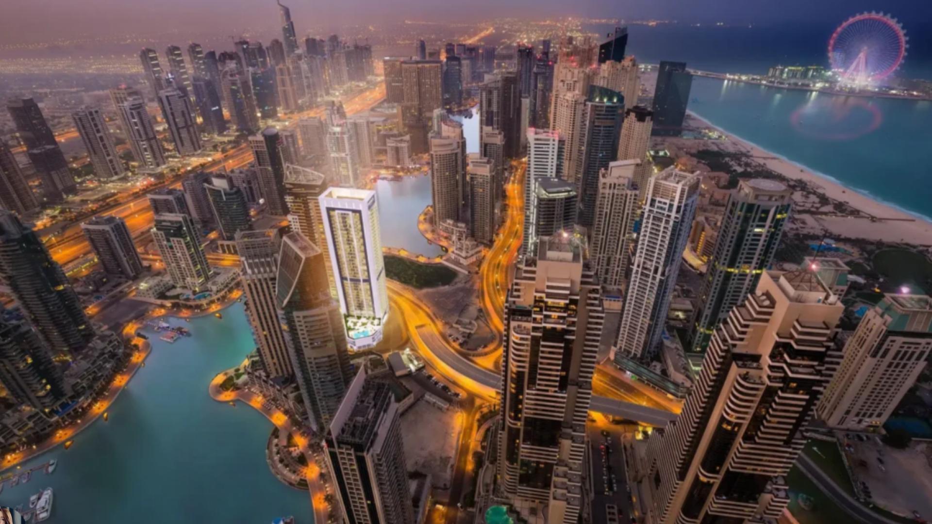 Modern Dubai Marina skyline view with yachts and palm trees in Pelagos community