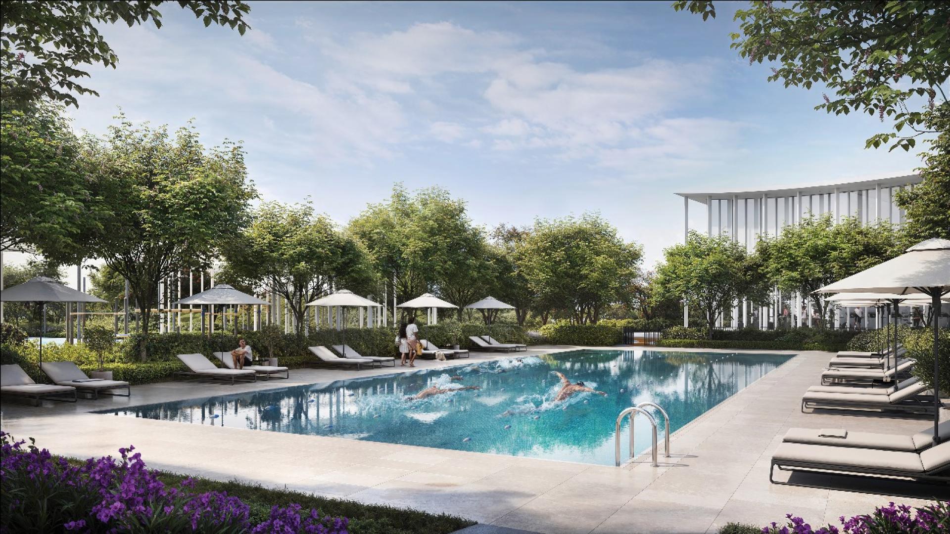 "Modern Hillsedge Apartment at Dubai Hills Estate with pool and tennis court view at dusk.",Outdoor pool area at Hillsedge Apartment, Dubai Hills Estate, with lounge chairs and greenery