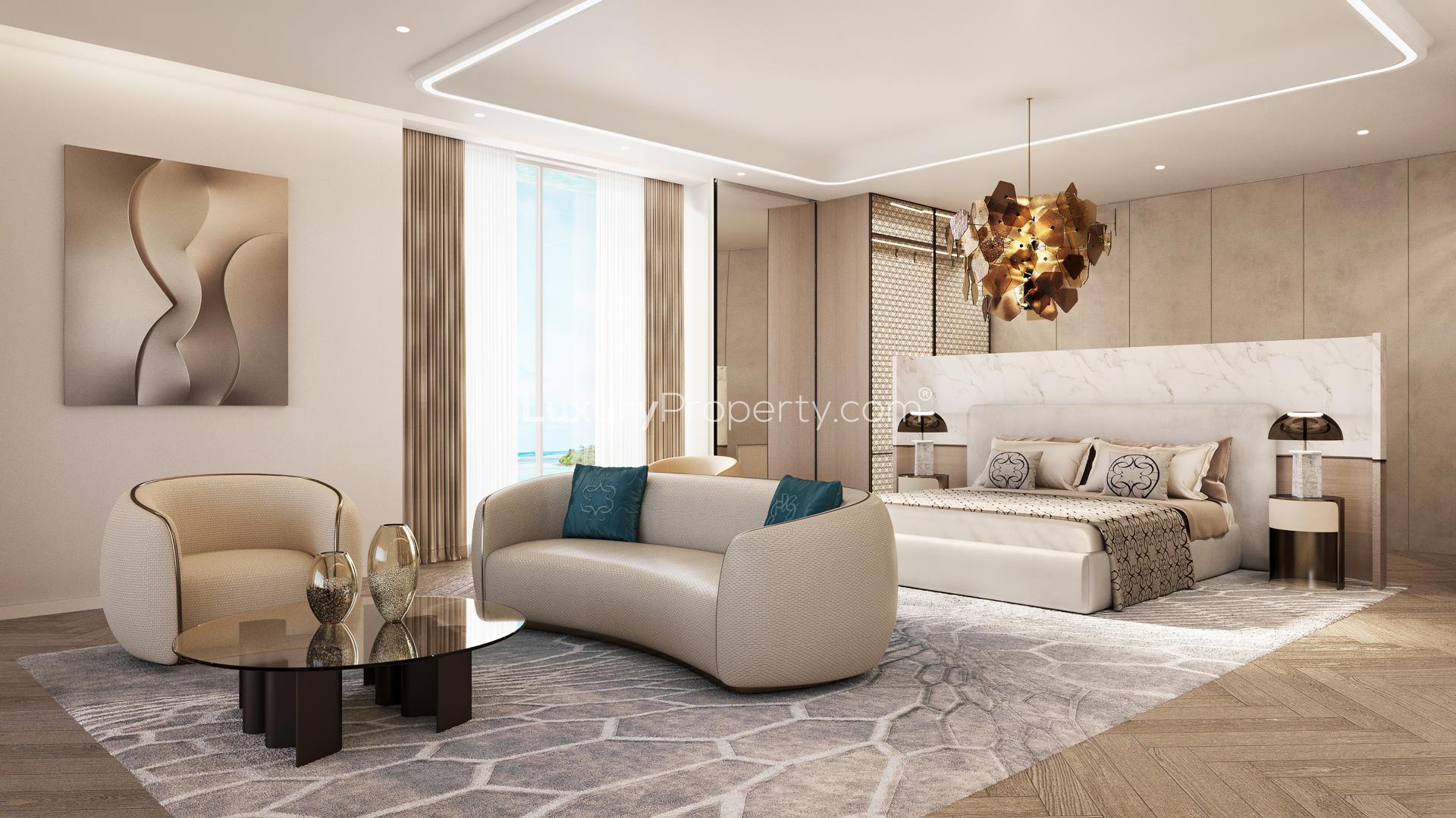 Luxurious living room in Samana Ocean Views suite, Maldives with pool-facing view