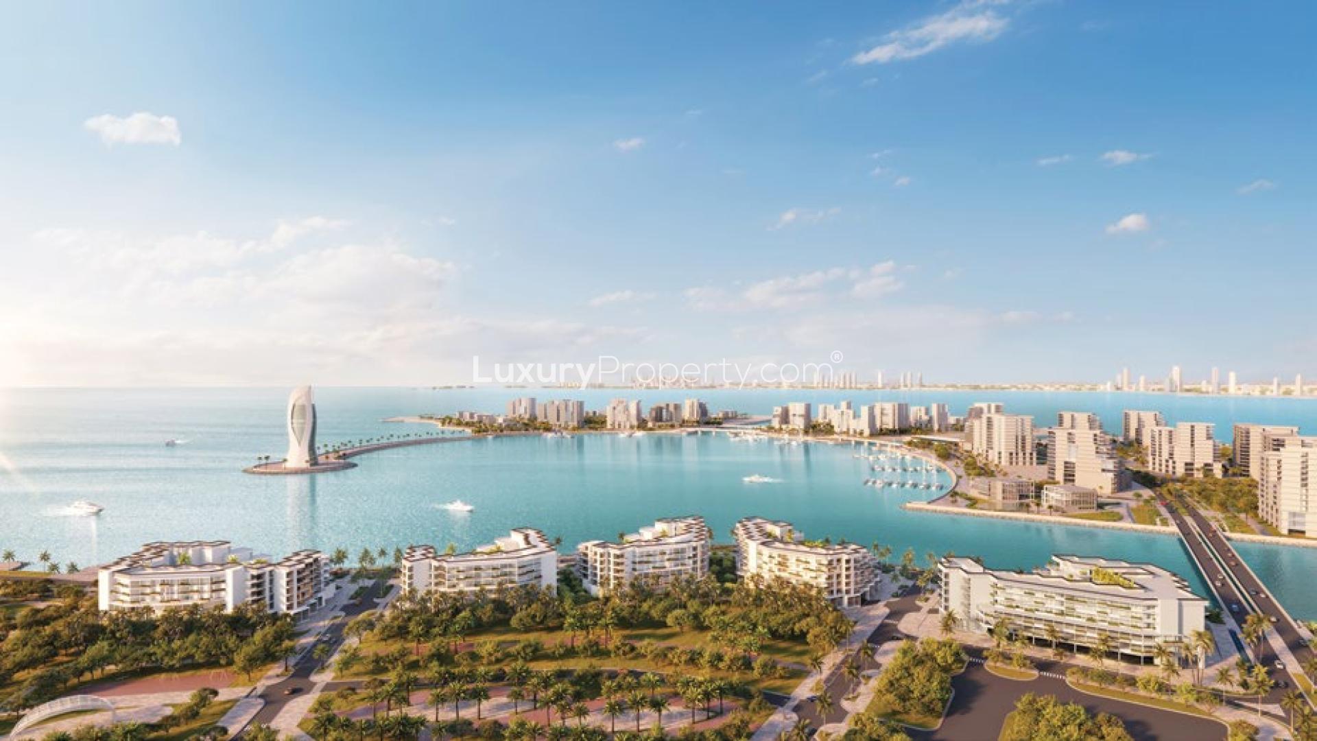 Waterfront view of luxury apartments in Qetaifan, The Weekend by Elie Saab, at sunset