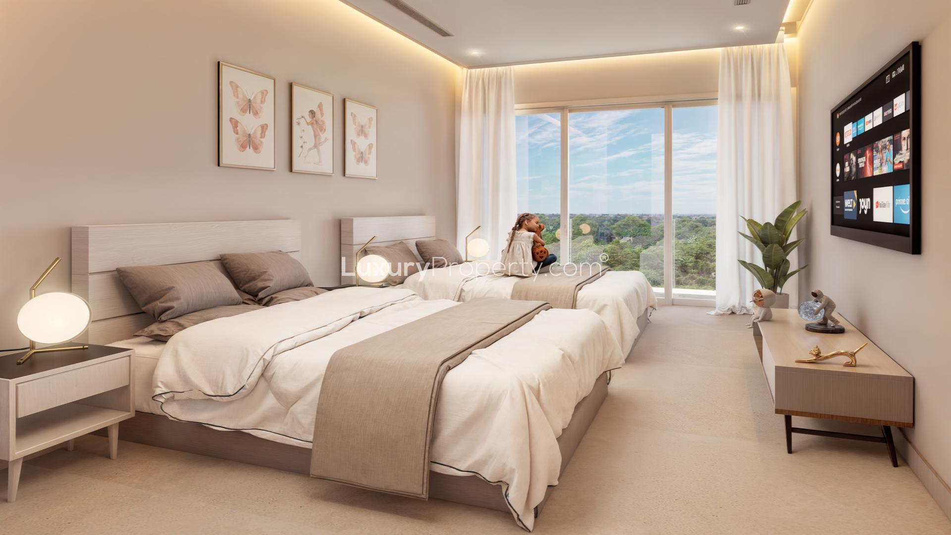 2-bedroom beachfront apartment living room in The Stella, Cozumel with modern entertainment setup