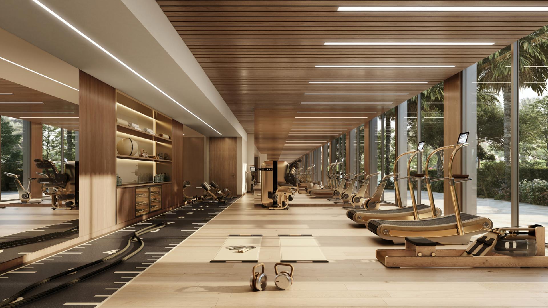 "Luxurious gym in Trump Tower Jeddah apartment for sale, featuring modern fitness equipment.",Luxury Trump Tower Jeddah apartment exterior with waterfront views and modern architecture