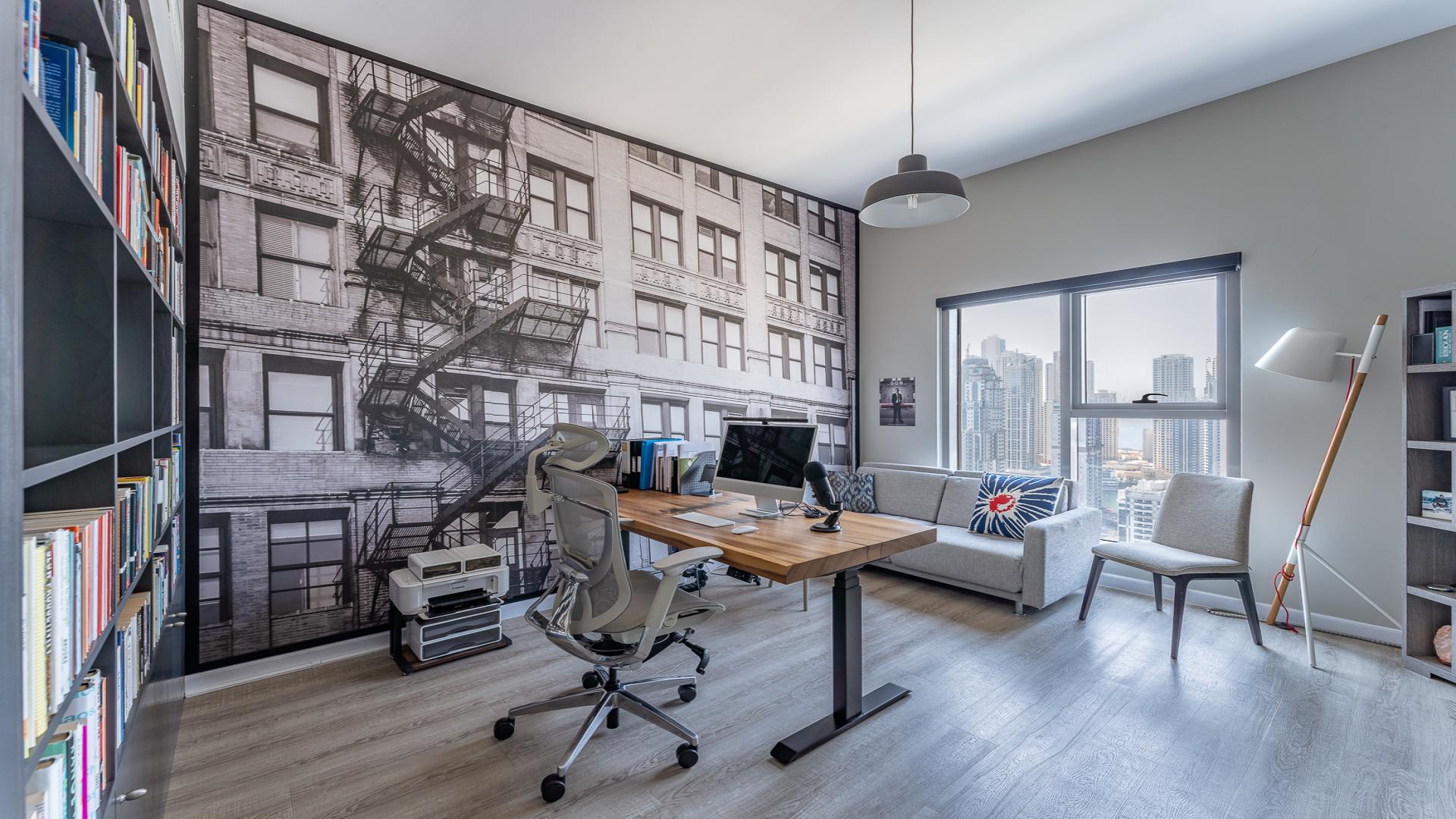 Modern loft-style living room in JLT apartment with stylish decor and open layout