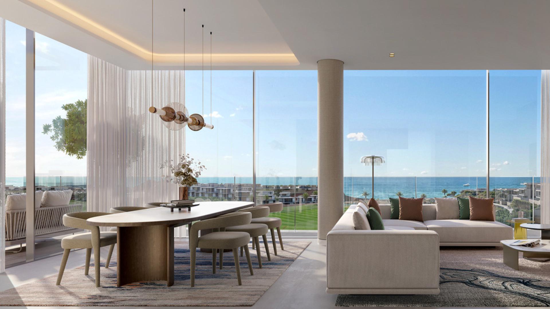 Modern kitchen and dining area with ocean view in AIDA Muscat apartment for sale