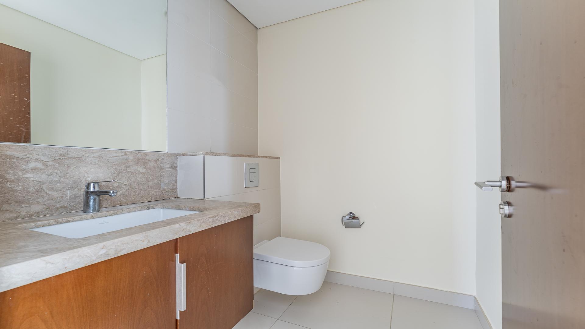 Modern kitchen and living area in Dubai Hills Estate 2-bedroom apartment, Park Heights