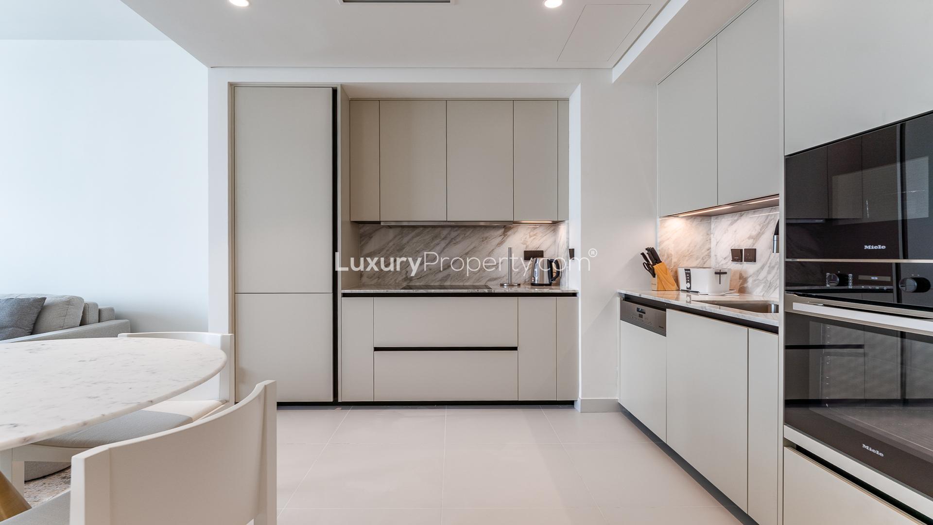 Modern living room in high-floor Marina Vista apartment, Emaar Beachfront, Dubai Harbour