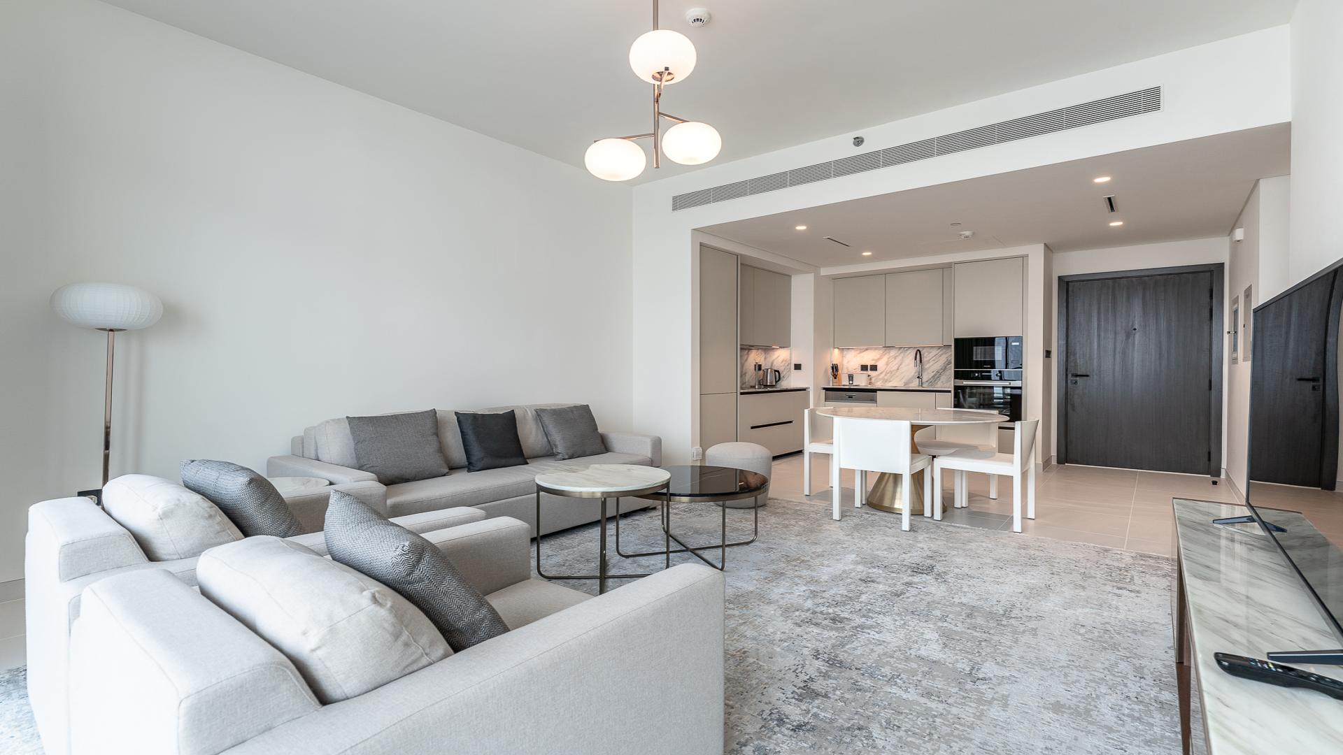 Modern living room in high-floor Marina Vista apartment, Emaar Beachfront, Dubai Harbour