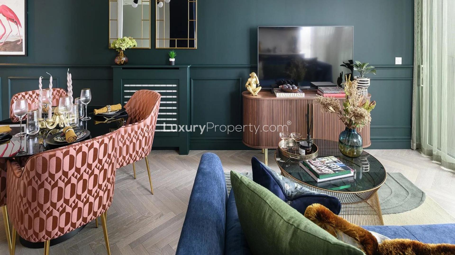 Galley Wharf Apartment balcony view overlooking Thames River and London skyline at night