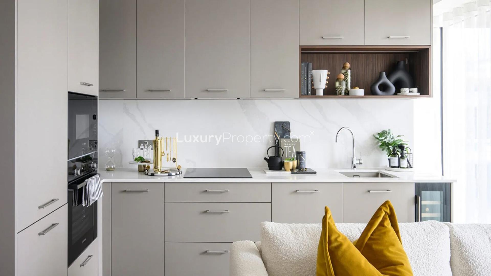 Elegant balcony view of Royal Arsenal Riverside apartment with garden and river scenery