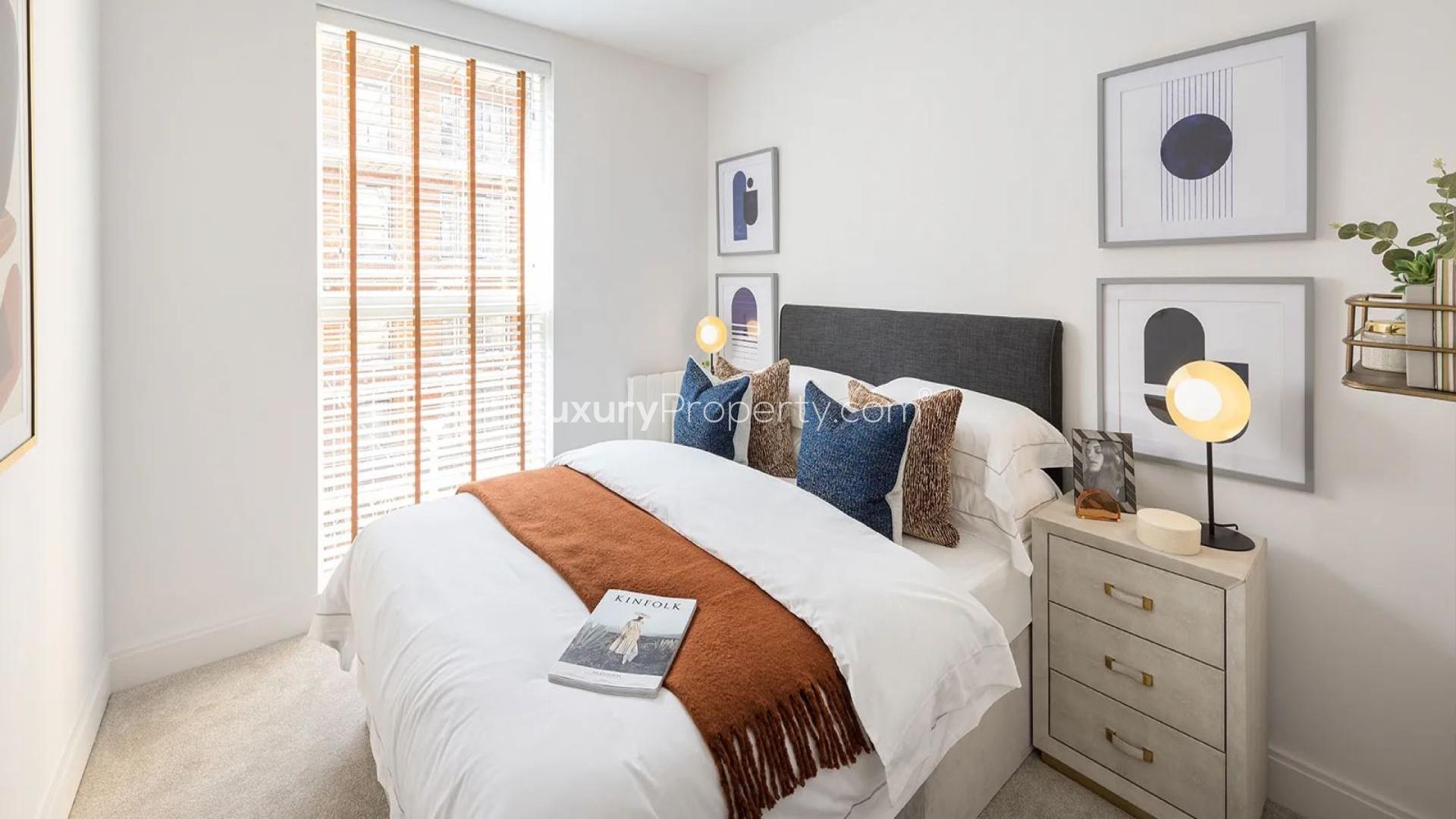 Modern kitchen with breakfast bar in Aquifer House apartment, Horlicks Quarter, Slough