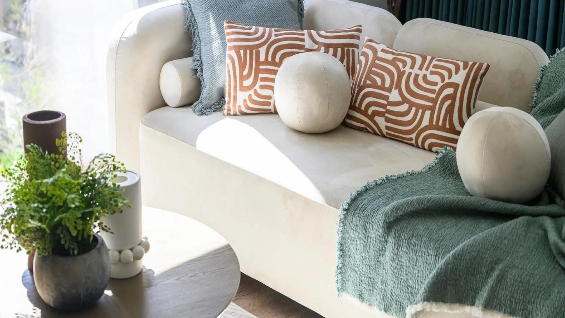 Two-bedroom apartment living area in Eden Grove, London with modern decor and balcony access