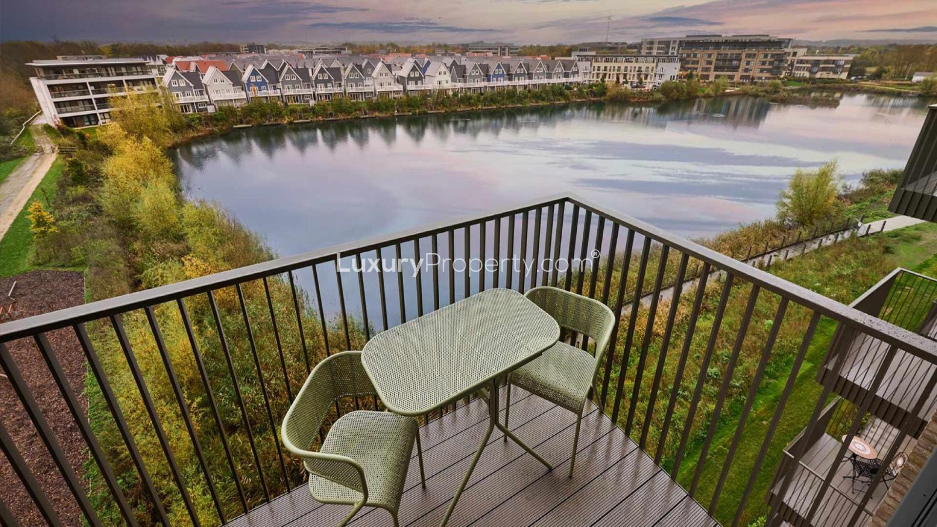 Contemporary living room in Bankside Gardens apartment, featuring stylish decor and balcony view
