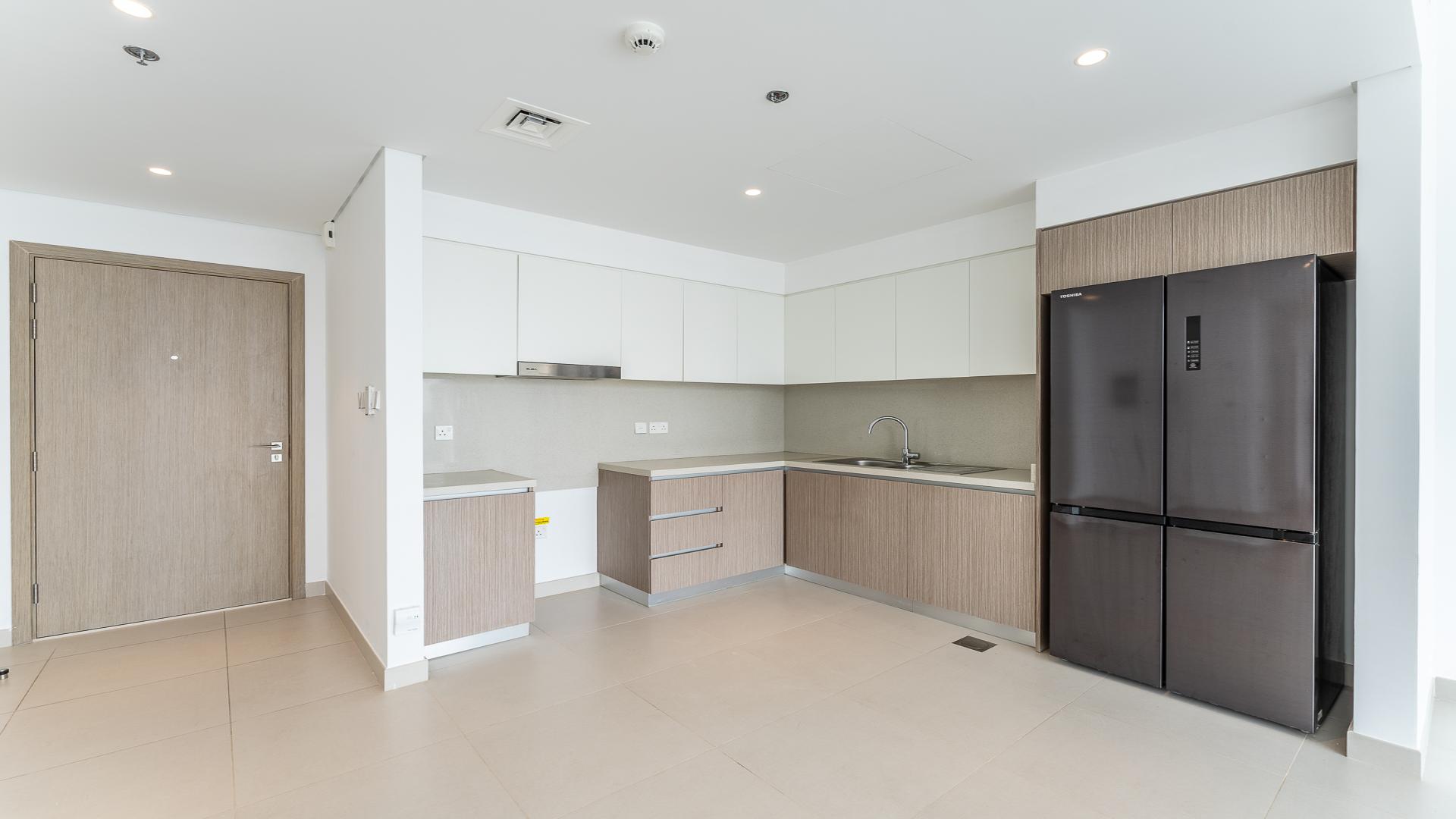 Modern kitchen and living area in Address Harbour Point apartment, Dubai Creek Harbour