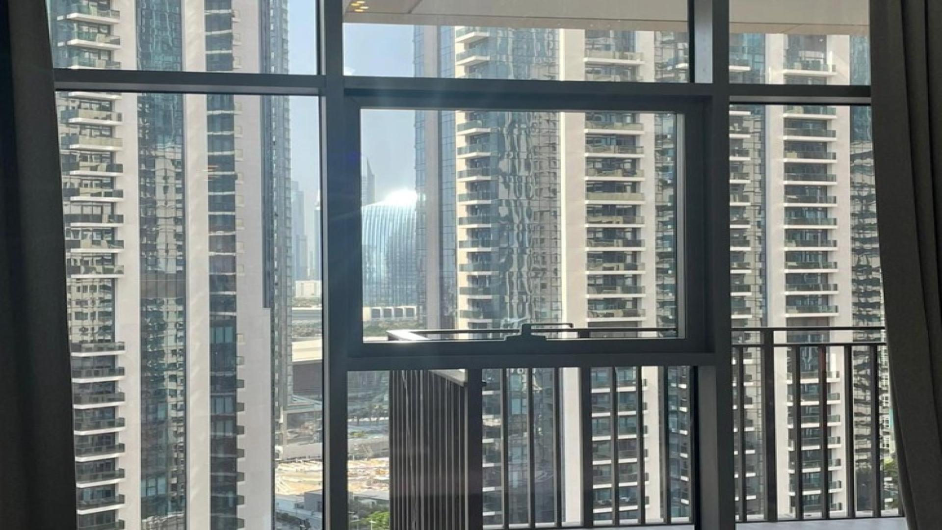 2-bedroom apartment view, Downtown Dubai, BLVD Crescent, high-rise buildings, for sale.