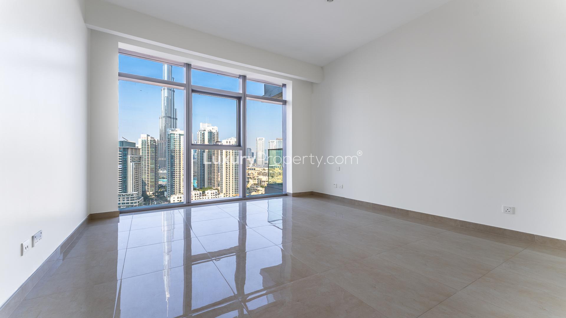 Modern kitchen and living area in Imperial Avenue apartment, Downtown Dubai, with city views