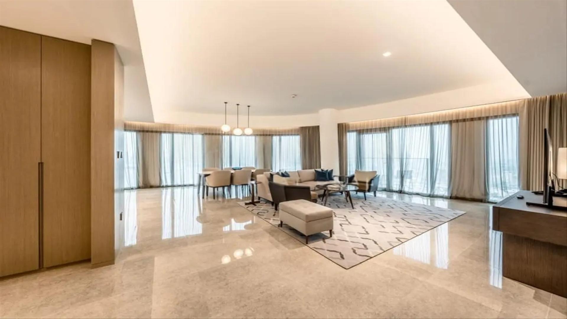Modern open-plan living area in Dubai Creek Harbour apartment, Address Harbour Point Tower 1