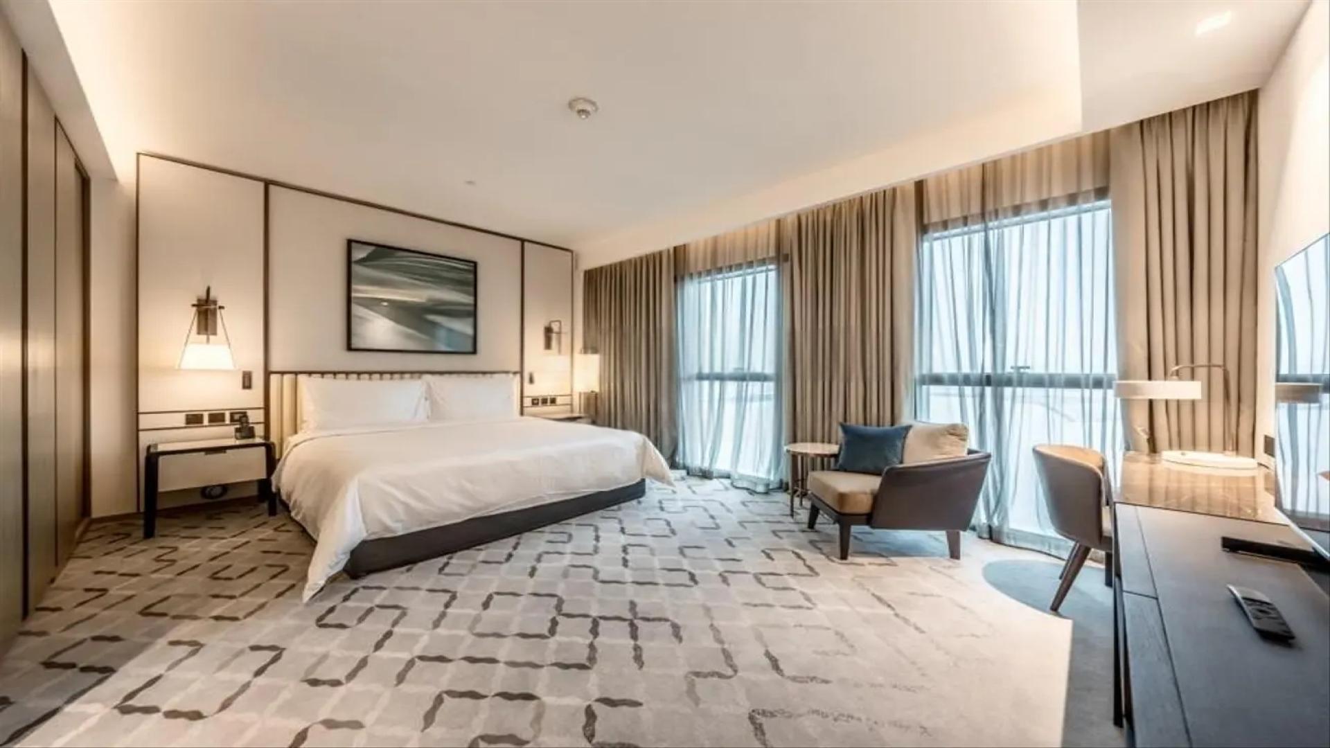 Luxurious bedroom in Dubai Creek Harbour apartment with waterfront view, Address Harbour Point