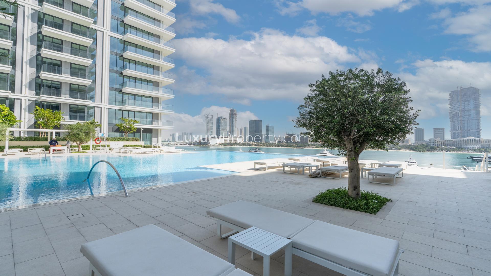 Modern apartment interior with built-in wardrobe and large windows, Emaar Beachfront view