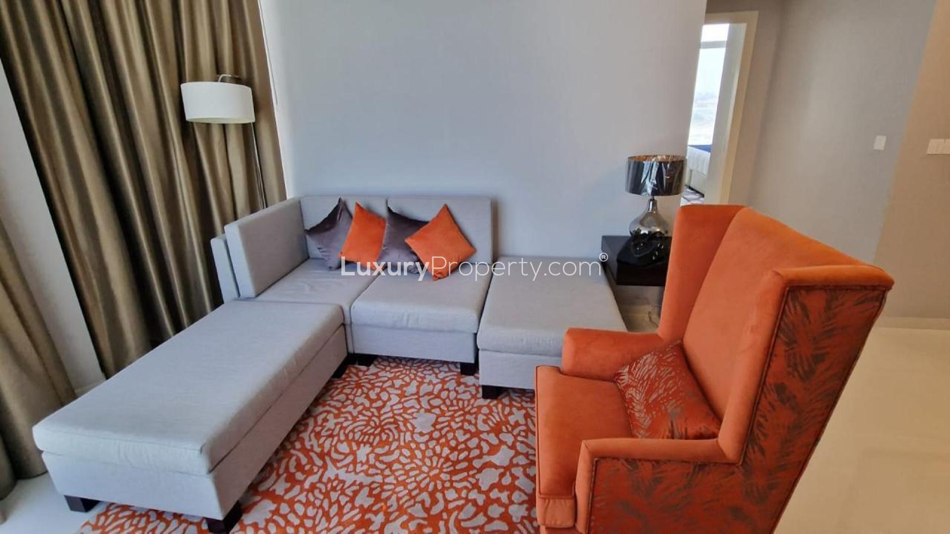 Modern bedroom in Artesia D apartment, Damac Hills, featuring stylish decor and natural light