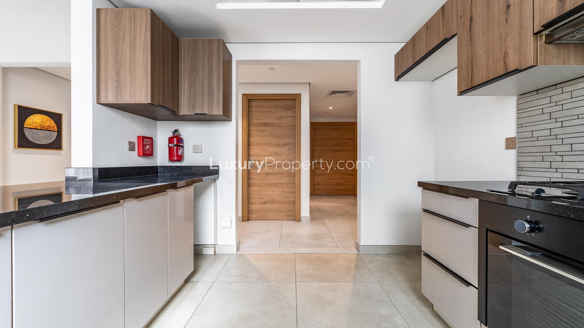 Modern JVC Eleganz apartment dining area with large windows and elegant decor for sale