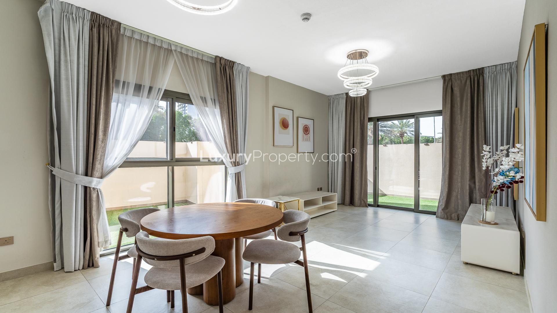 Modern dining area in Eleganz by Danube apartment, JVC, featuring stylish decor and natural light