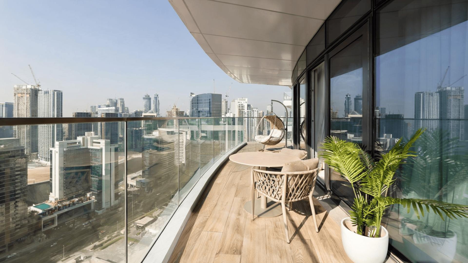 Furnished bedroom with modern decor in Downtown Dubai apartment, Imperial Avenue