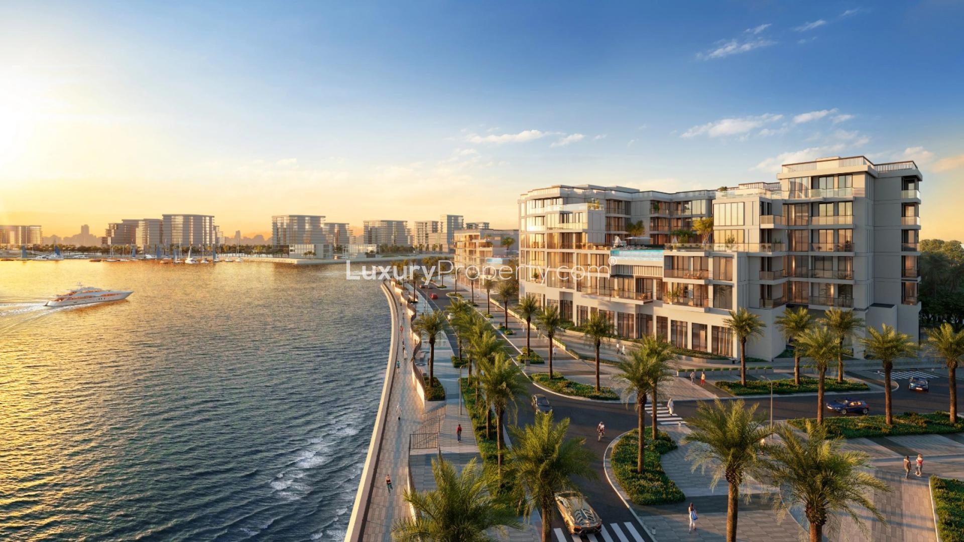 Modern waterfront apartment building in Doha, Qatar, featuring palm trees and scenic views