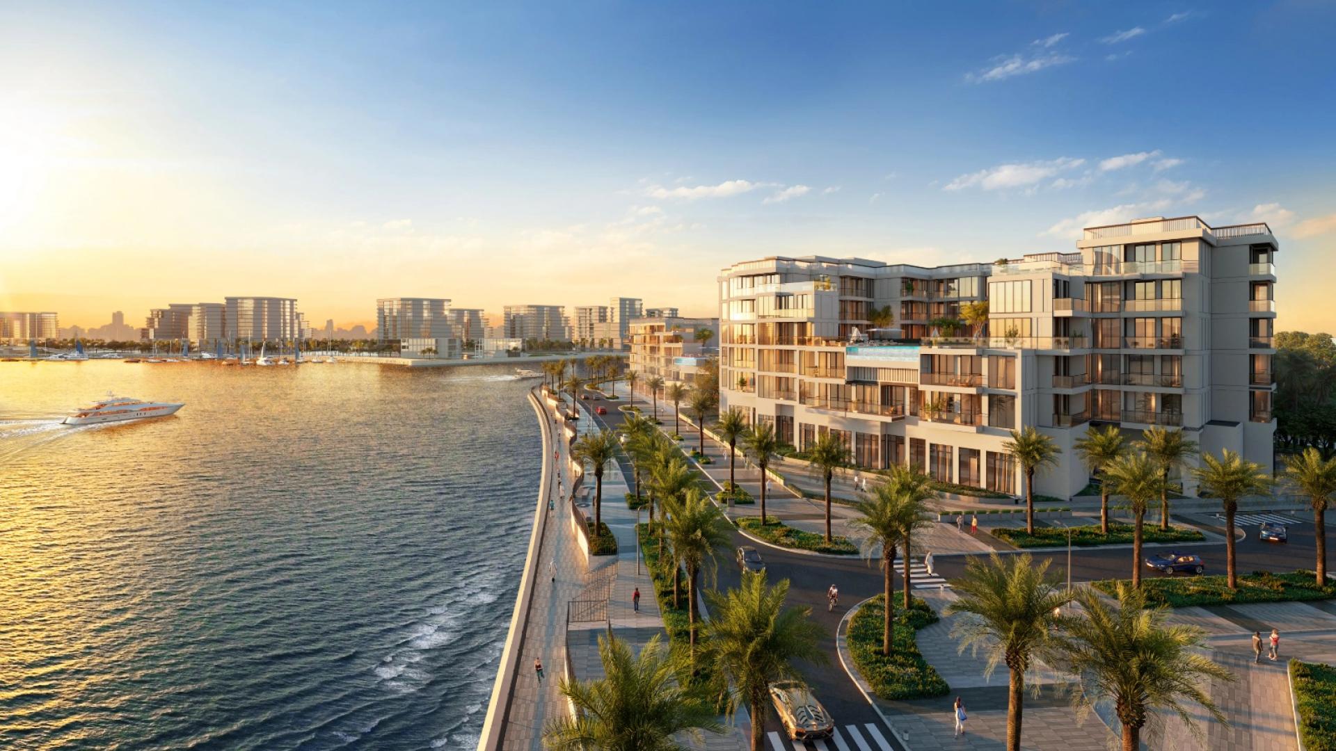 Modern waterfront apartment building in Doha, Qatar, featuring palm trees and scenic views
