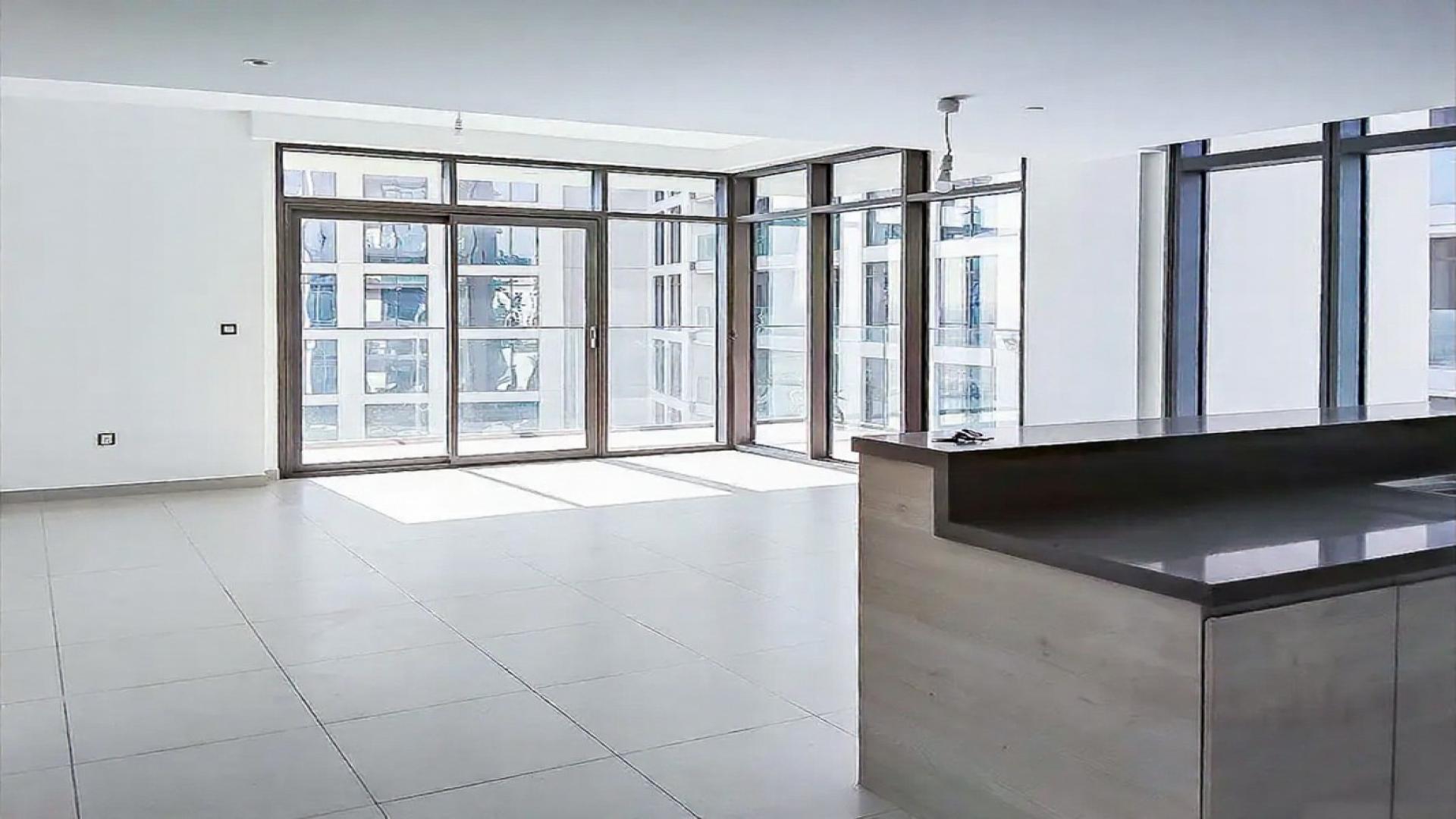 "High floor apartment with sea view, pool in Dubai Creek Harbour, The Cove Building 1.",High-floor apartment interior with large windows in Dubai Creek Harbour, The Cove Building 1