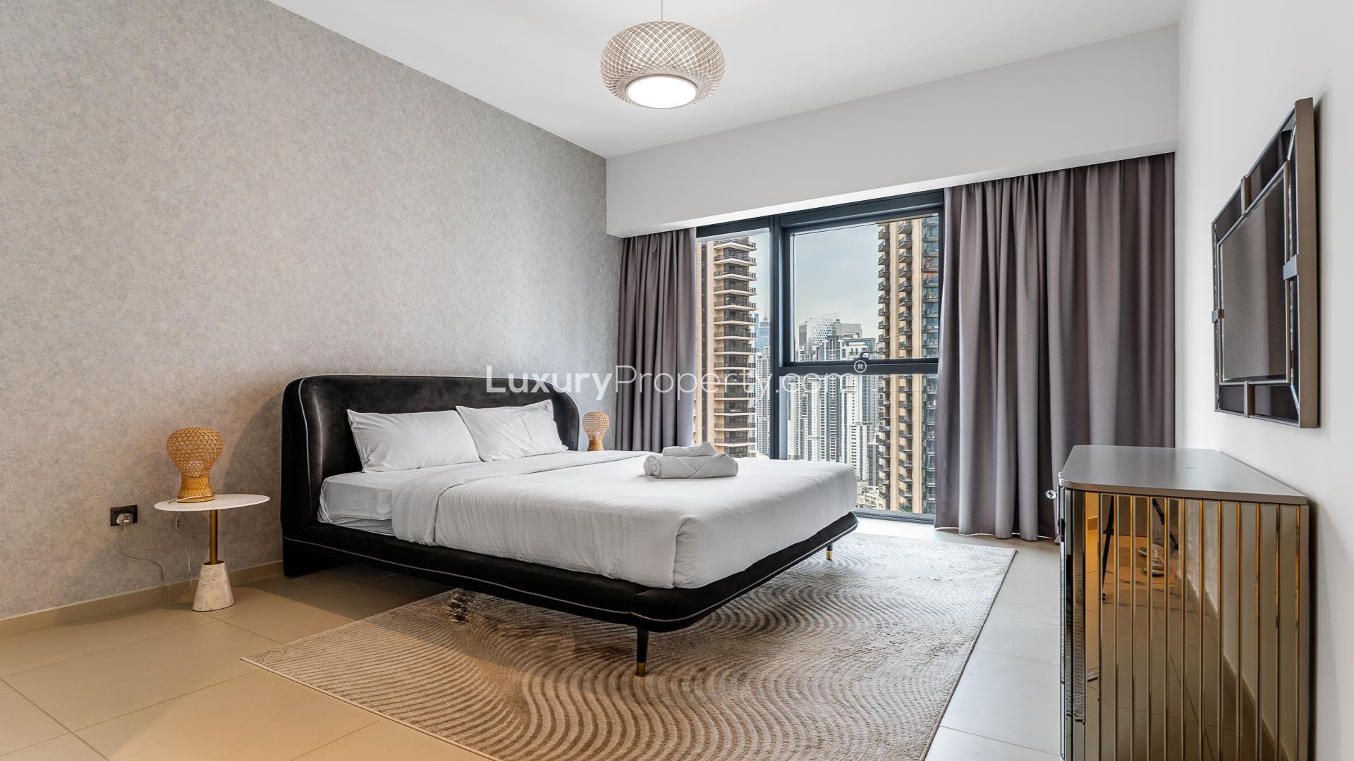 High-floor furnished apartment living room and kitchen in Act Towers, Downtown Dubai