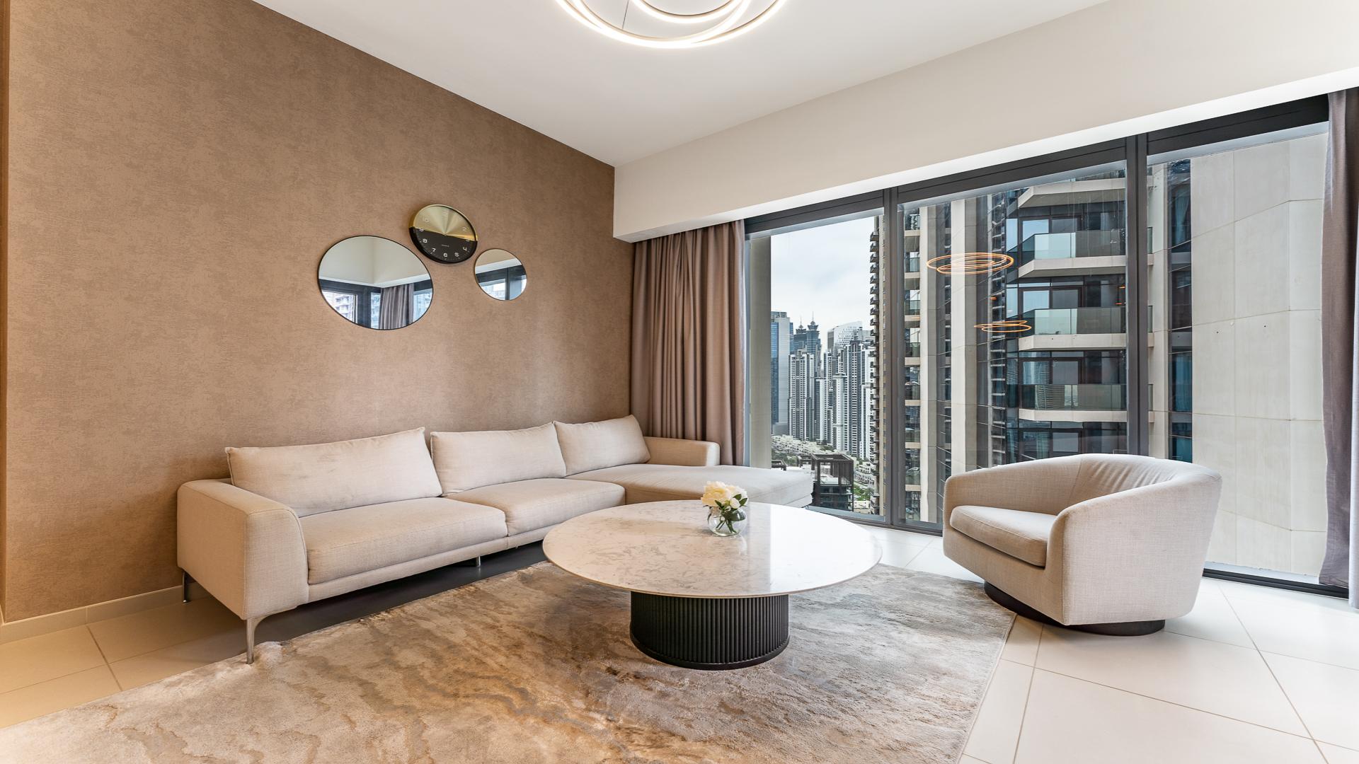 Modern furnished living room in high-floor two-bedroom apartment, Act Towers, Downtown Dubai