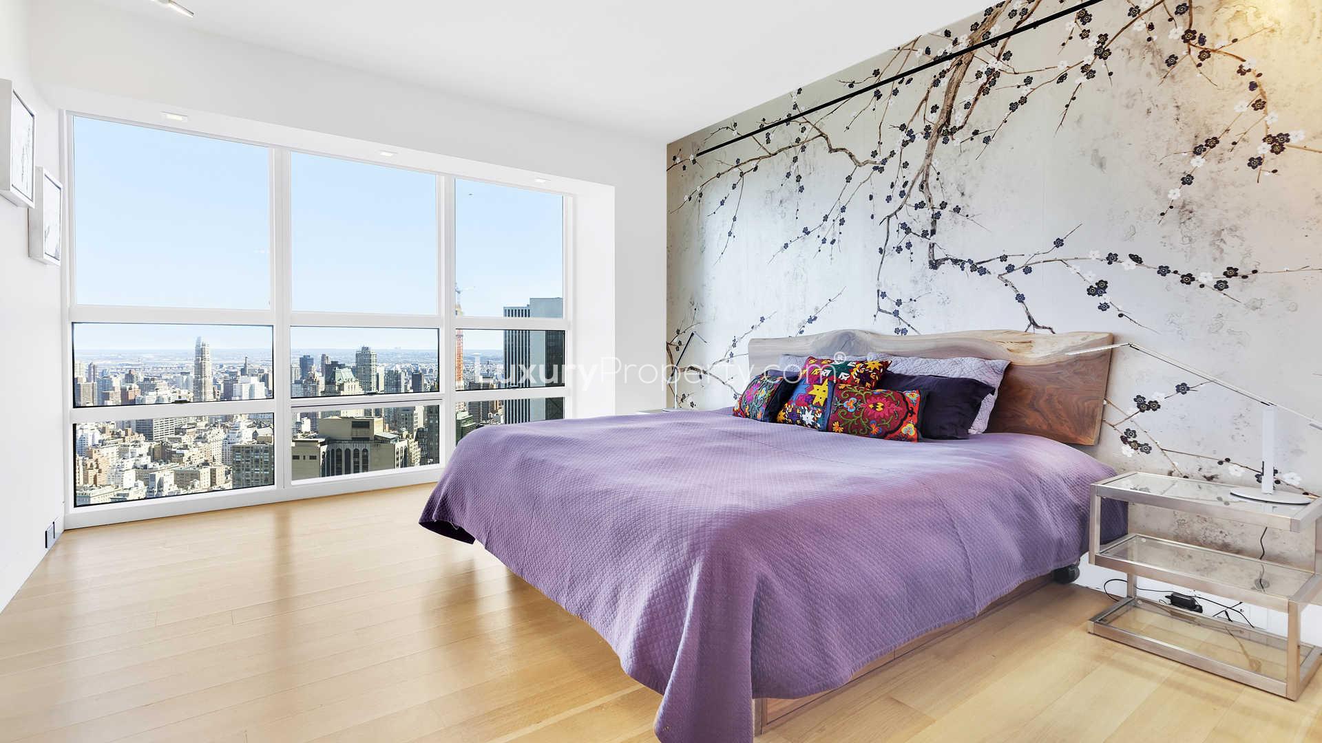 Bedroom with stunning city views in Manhattan apartment at 146 West 57th Street