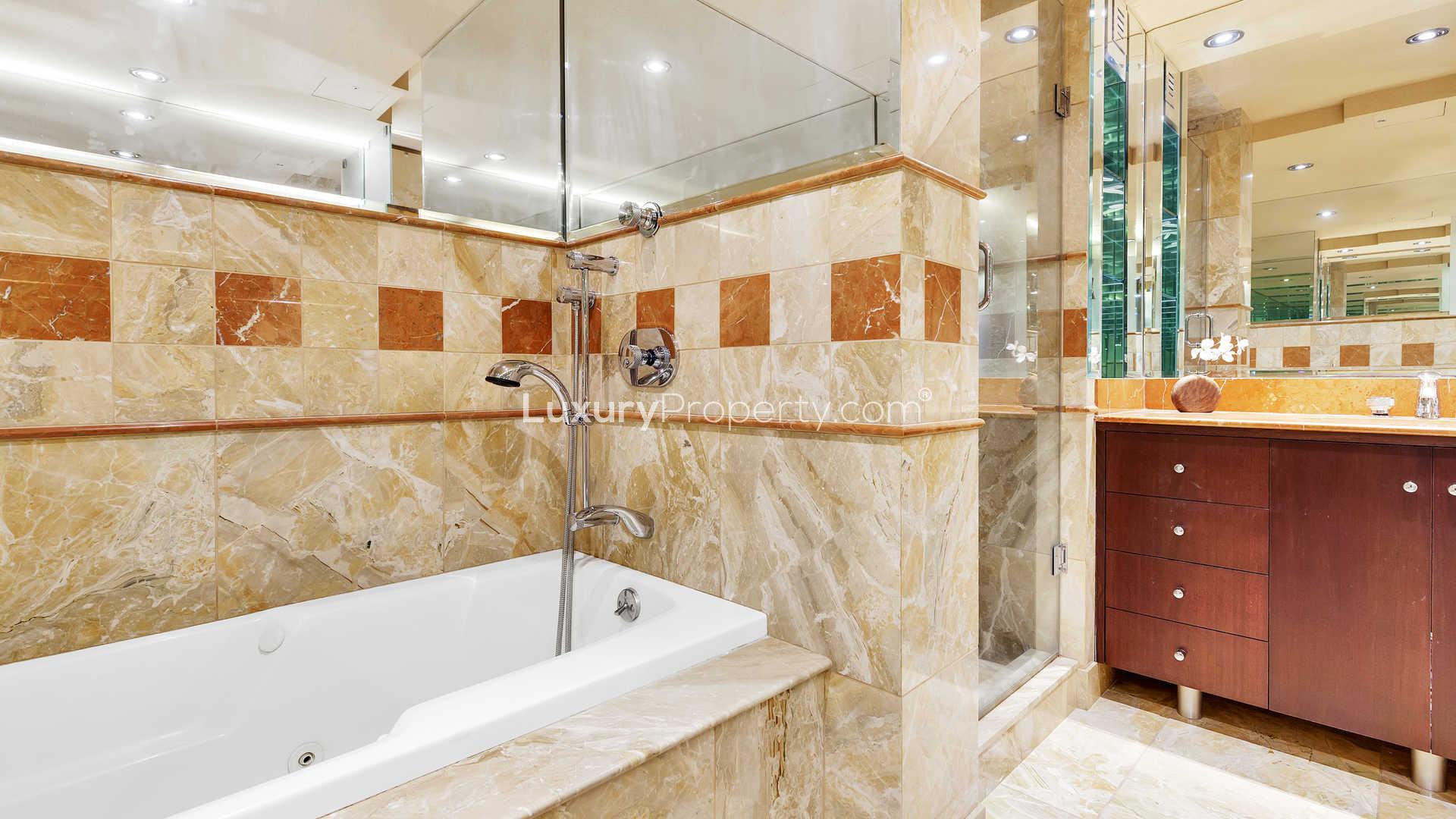 N/A,Luxurious bathroom with marble tiles in Manhattan 2-bedroom apartment at 146 West 57th Street