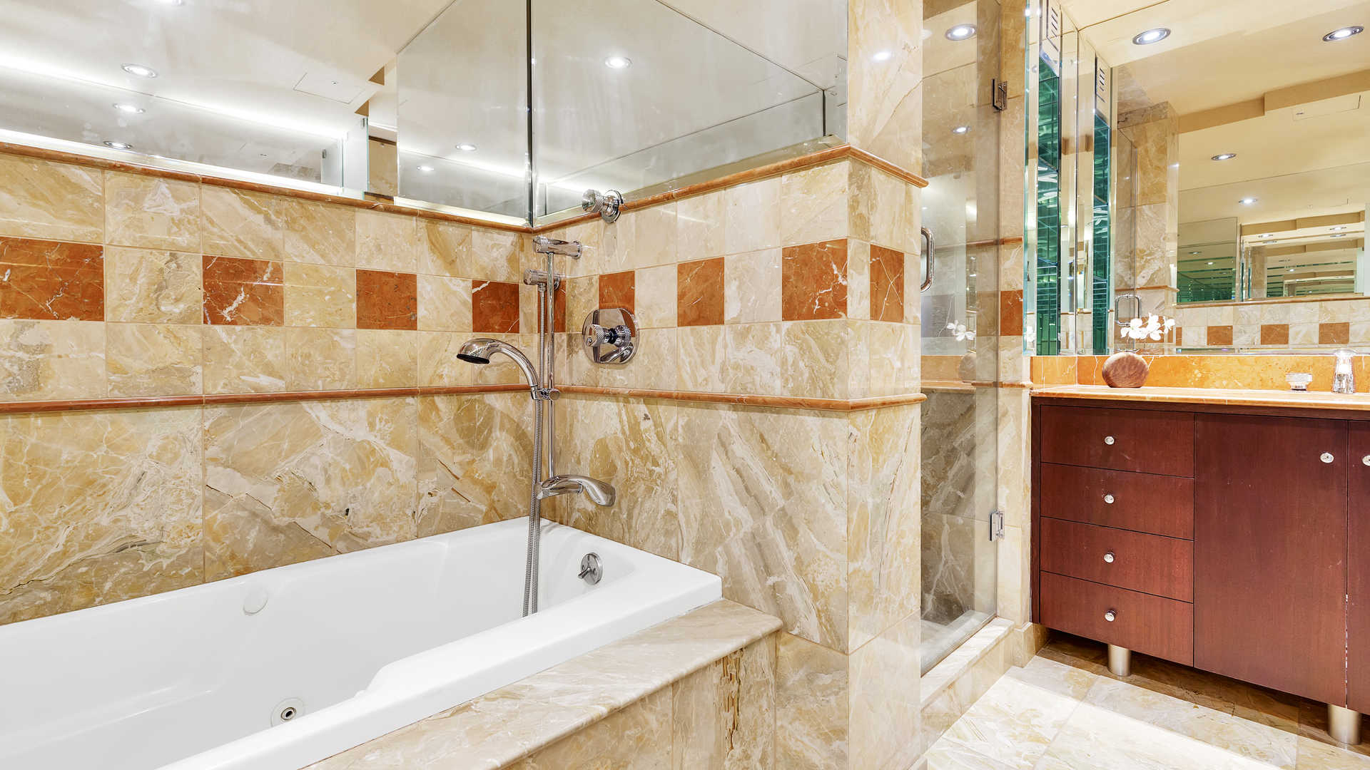 N/A,Luxurious bathroom with marble tiles in Manhattan 2-bedroom apartment at 146 West 57th Street