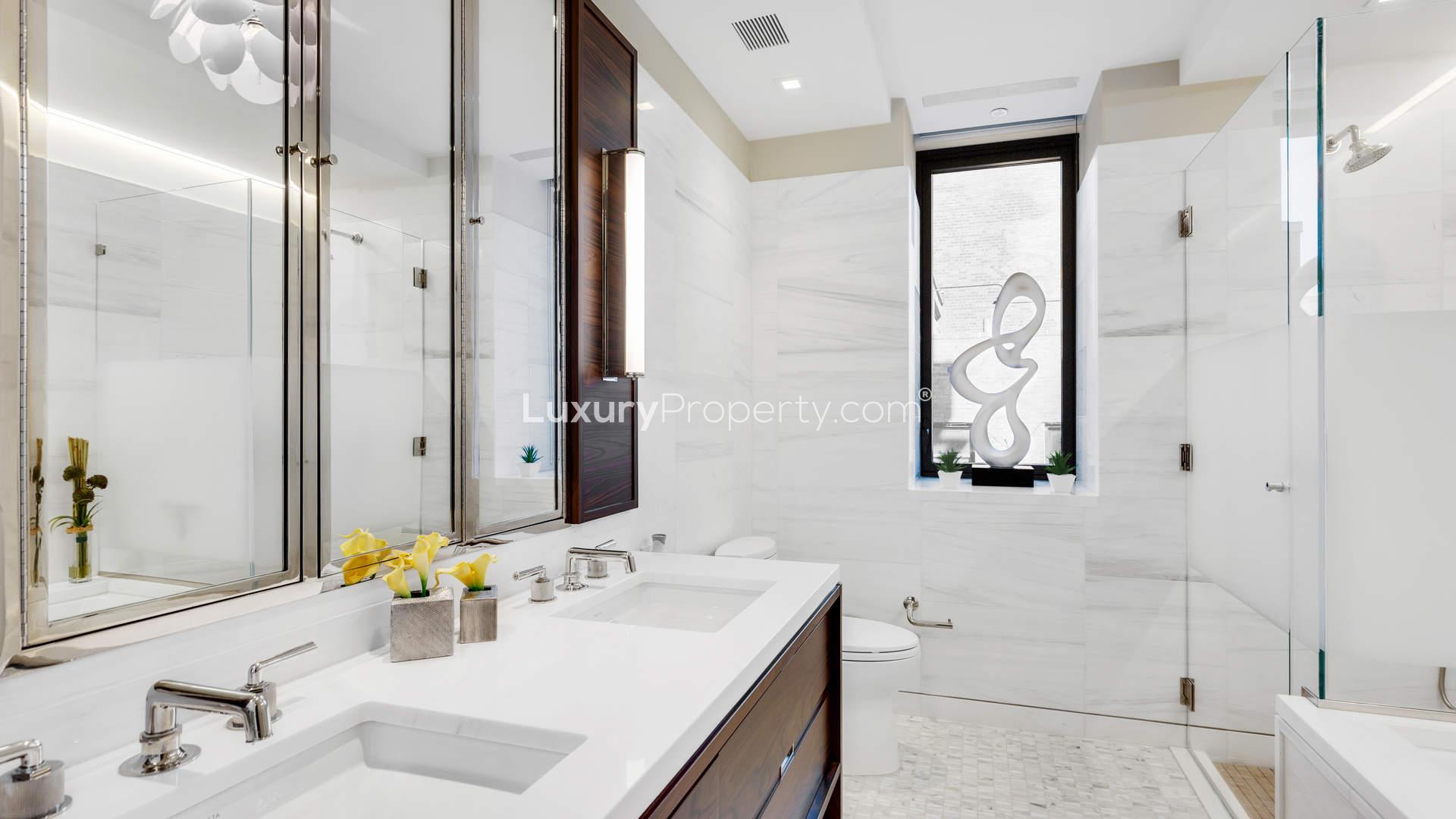 Luxury gym in Manhattan apartment with modern equipment and city views