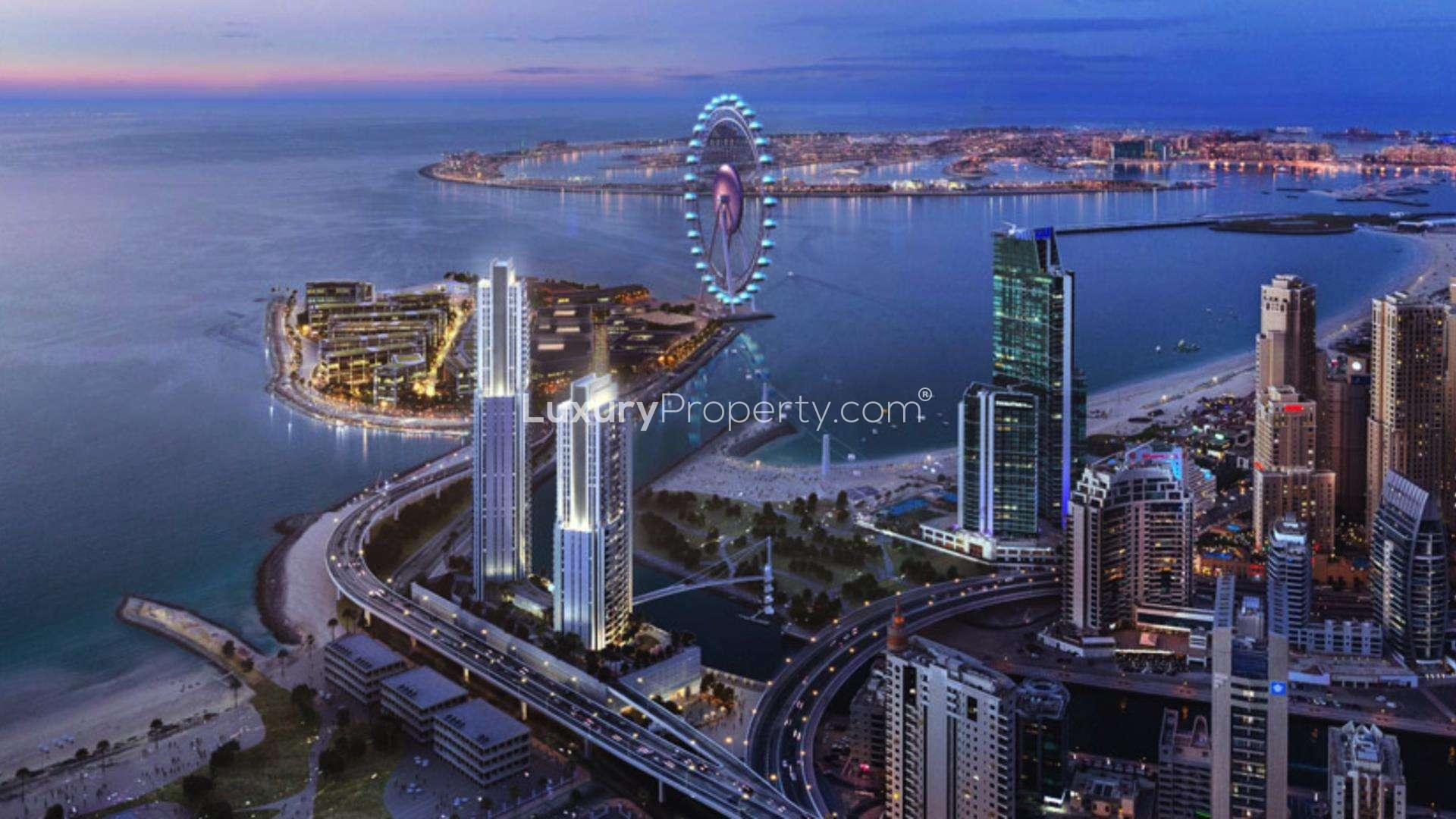 Balcony view of Dubai Marina beach and Ferris wheel from two-bedroom beachfront apartment