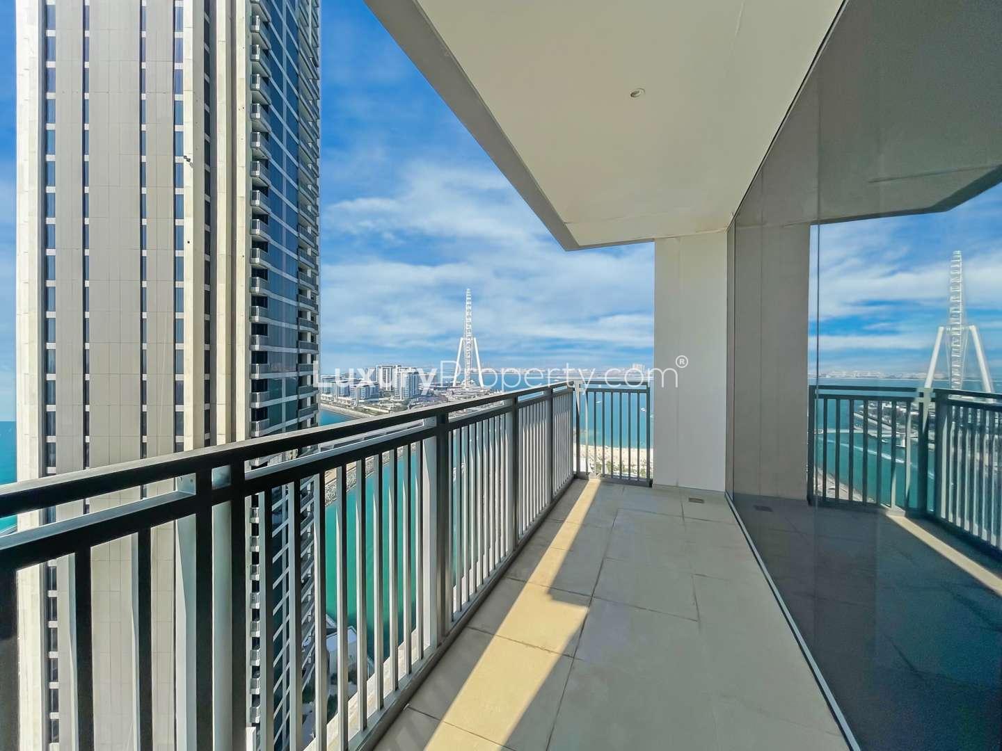Brand new Dubai Marina apartment interior, spacious living area with modern kitchen, sea views