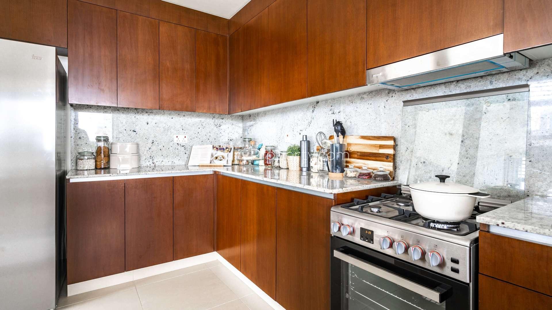 High-floor Dubai Hills Estate apartment living room with modern decor, large window, stylish furniture