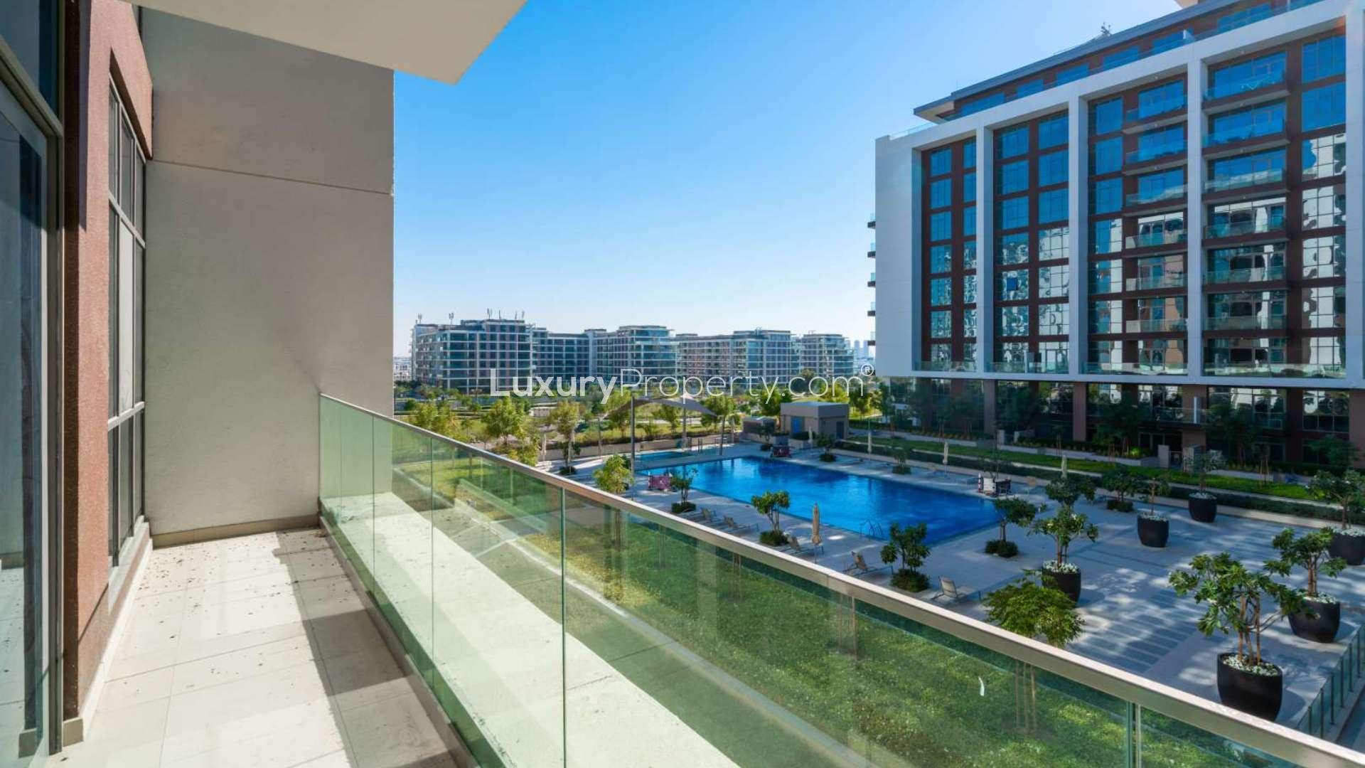 Modern living room in Dubai Hills Estate apartment with large windows and natural light