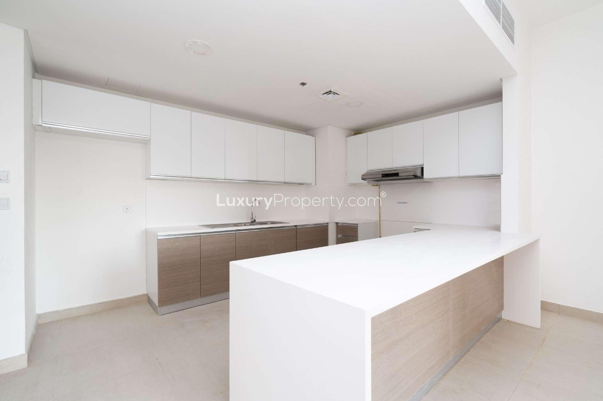 Modern kitchen in luxury Alandalus apartment for sale, featuring sleek cabinetry and spacious design