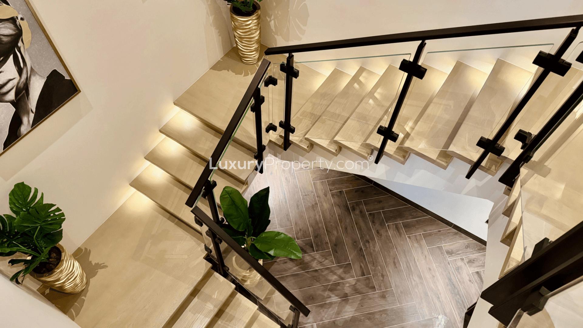 Luxurious rooftop pool with city skyline view at One Zaabeel Tower apartment