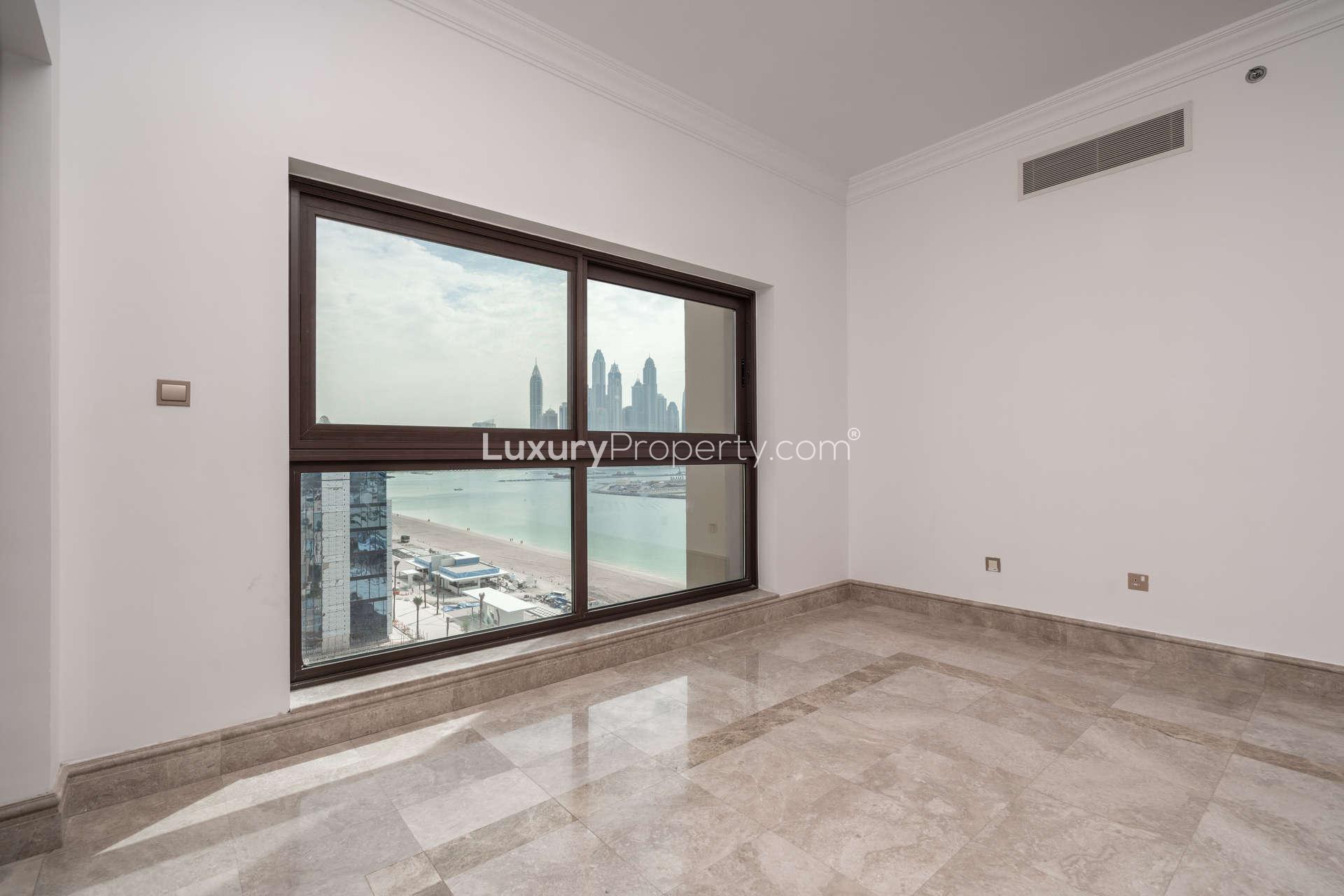 Corner apartment interior with marble flooring and wooden doors, The Fairmont Palm Residences