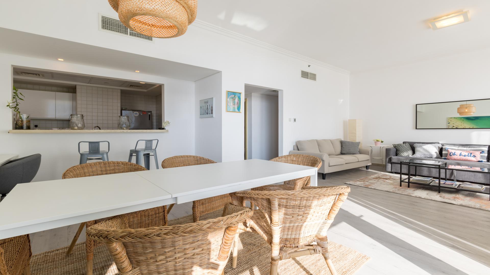 Fully furnished living and dining area in luxury Jumeirah Beach Residence apartment