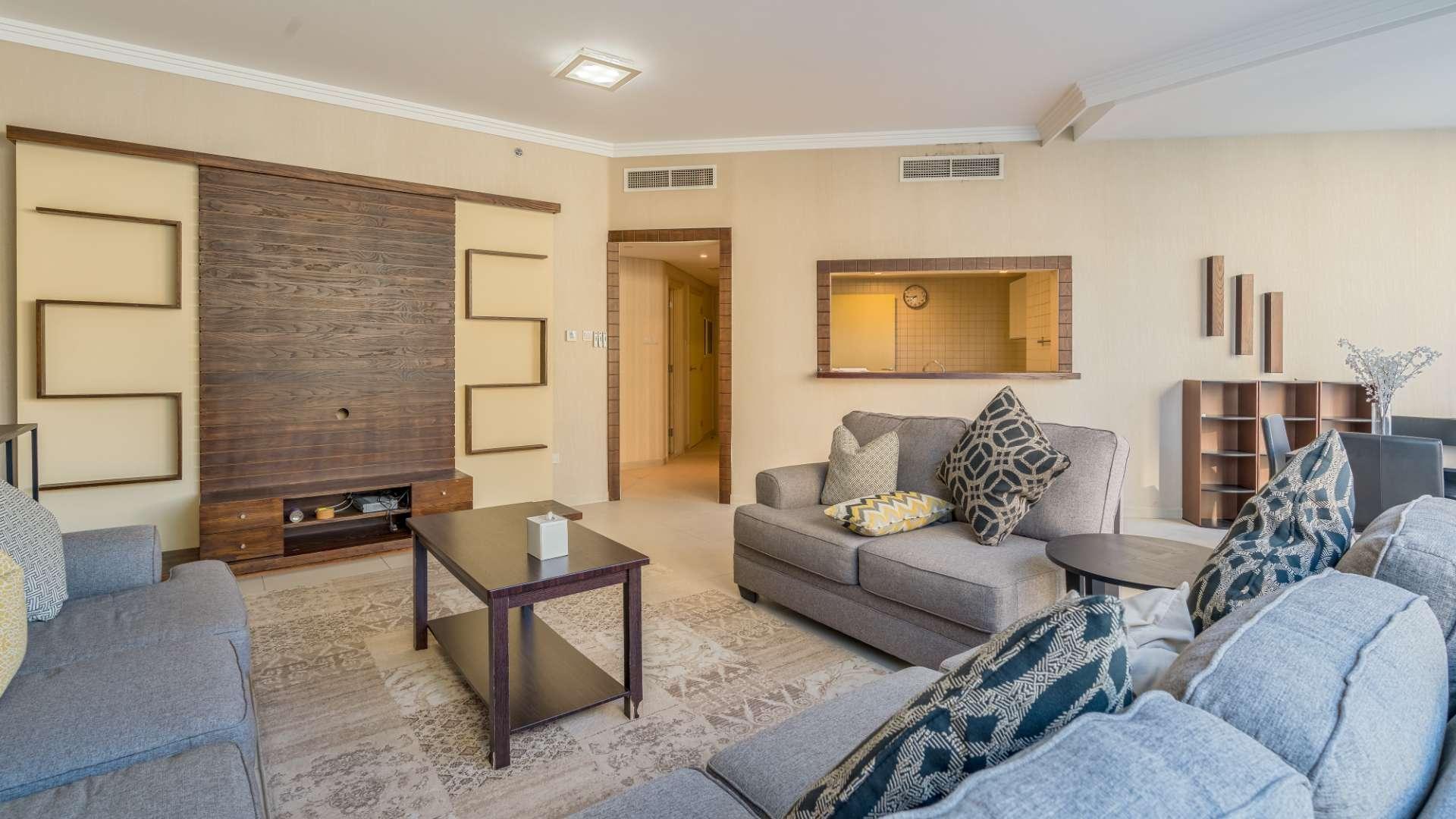 Luxurious living room in Al Bateen apartment, JBR with modern decor and large windows