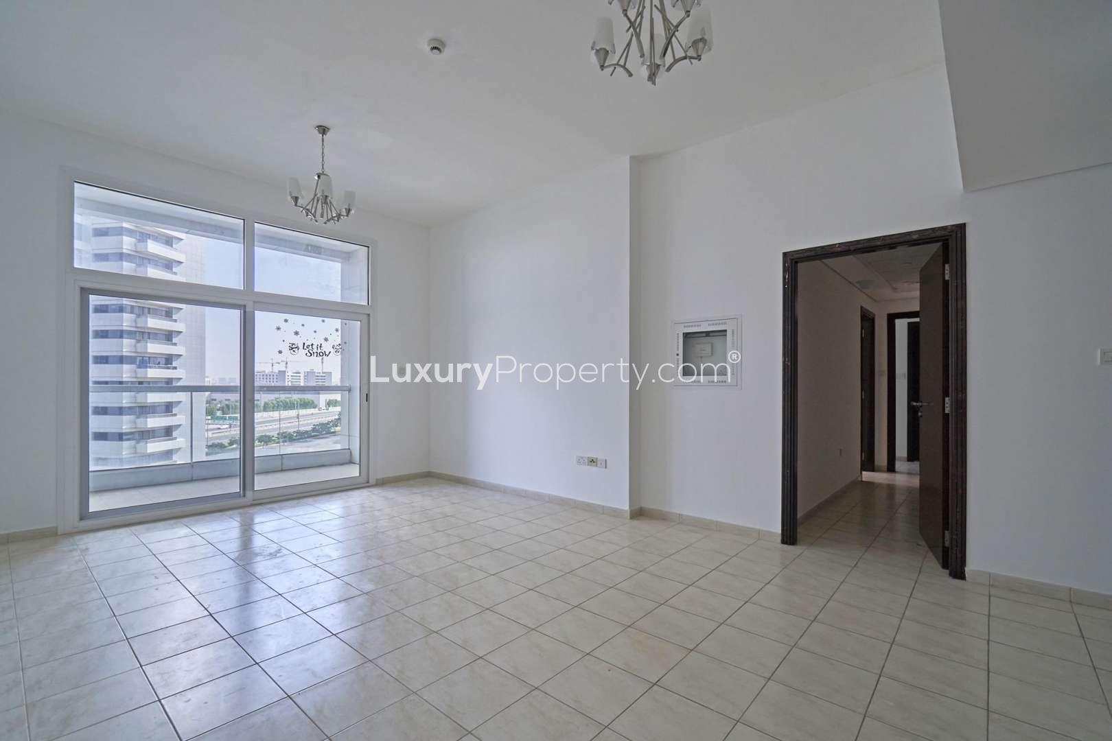 Outdoor pool area with city views at Al Fahad Towers, Barsha Heights apartment for sale