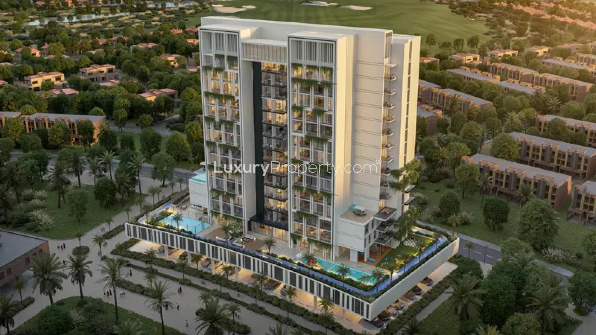 "Elegant lobby of Fairway Residences in Dubai Sports City, featuring modern design and decor.",Aerial view of Fairway Residences, Dubai Sports City apartment building surrounded by greenery