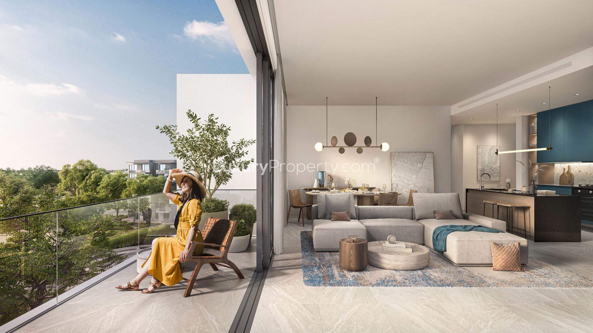 Modern open-plan living room and kitchen in Ghaf Woods apartment, Dubai Land