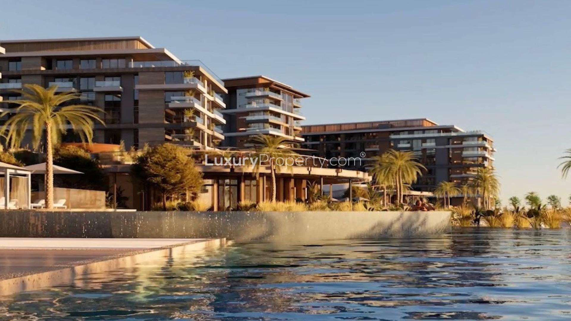 Luxury waterfront apartments in Ellington Cove, Dubai Islands with modern architecture and palm trees